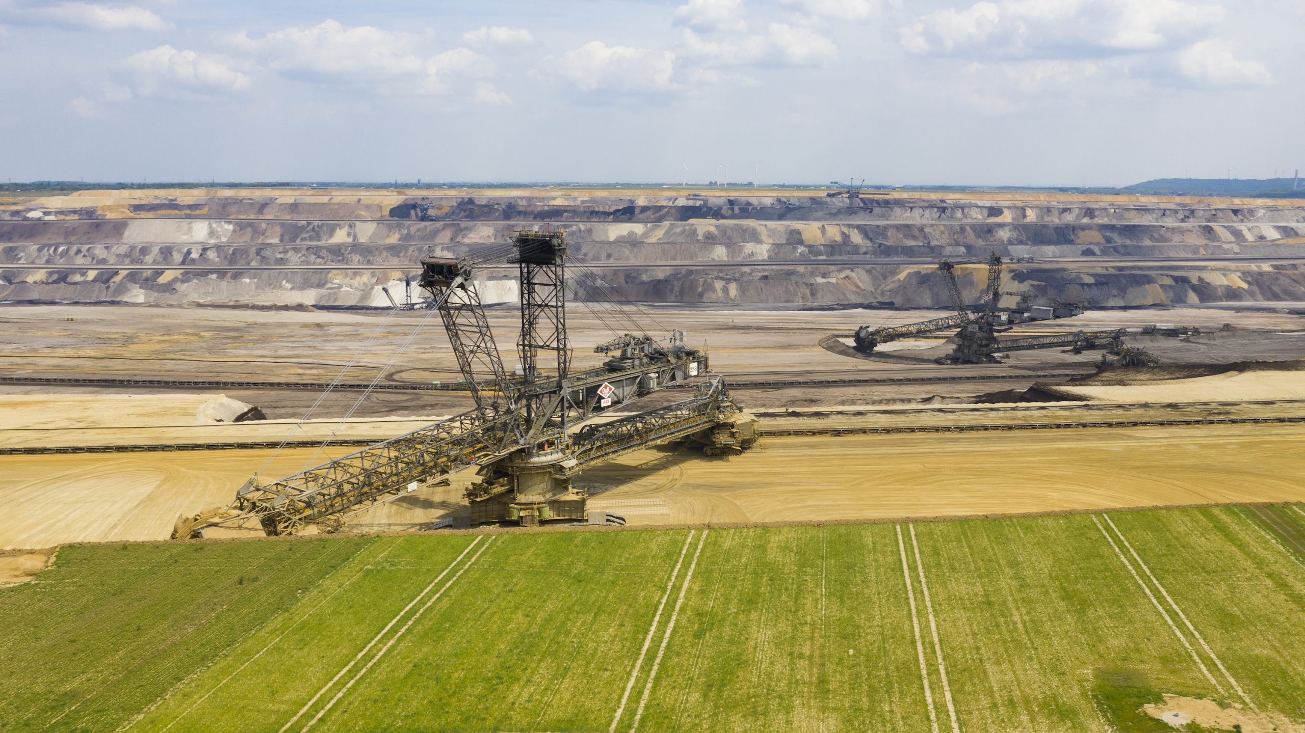 Large opencast mine with excavator